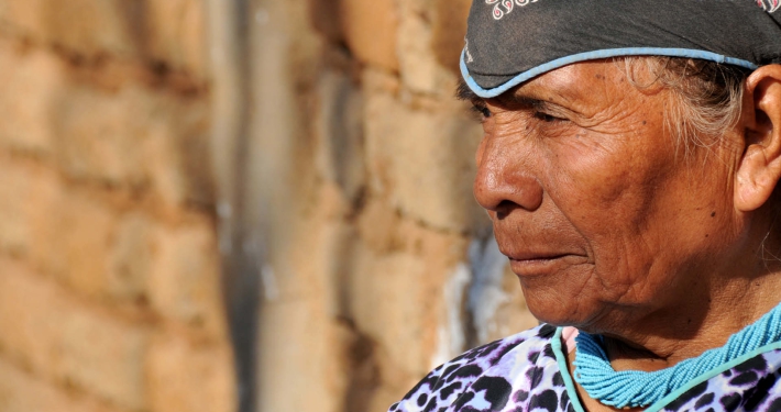 An elderly woman in traditional clothing