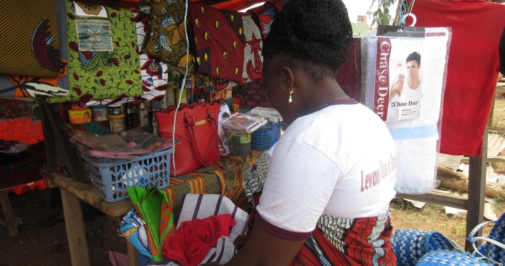 A woman in the small shop she was helped to start, Ivory Coast
