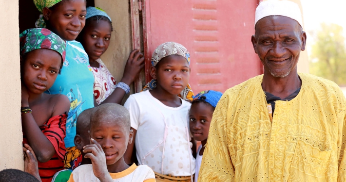 An elderly man with a group of young children, Mali